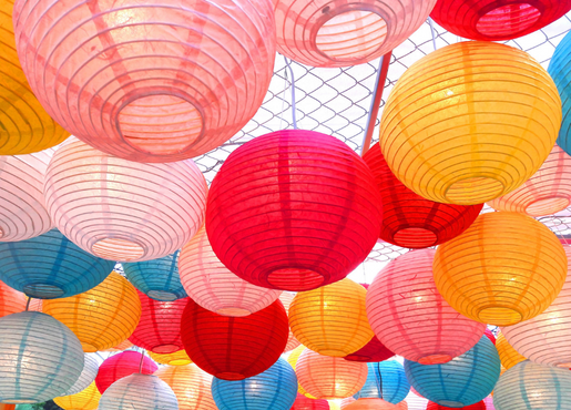 Red, orange, teal, and pink paper lanterns. 