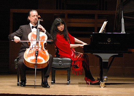 man playing cello and woman playing piano