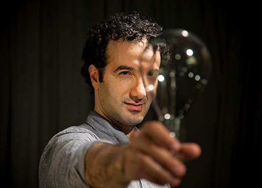 man holding a lightbulb