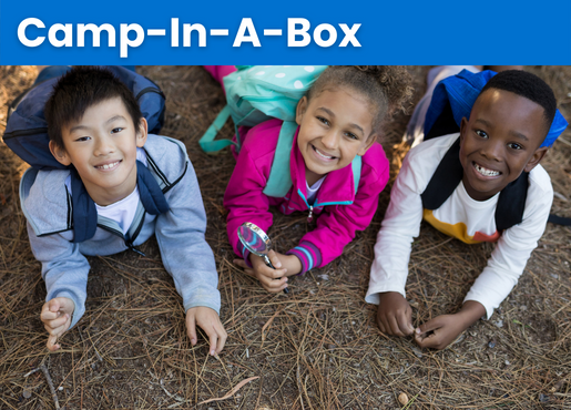 diverse nationality of children laying on ground smiling. 