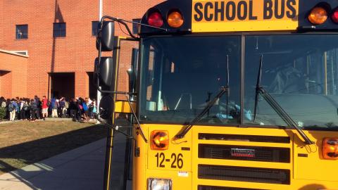 A school bus drop off students in Nashville, Tenn., where the city's school district has experienced one of the worst shortages of drivers in the country.