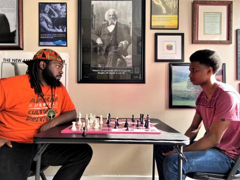  Ernest Levert Jr. (left) plays chess with Dua waNgure (right) at the Cooperative Chess Cultural Center in Columbus. The space is designed to be inclusive of all races, genders and ethnicities. <br/>