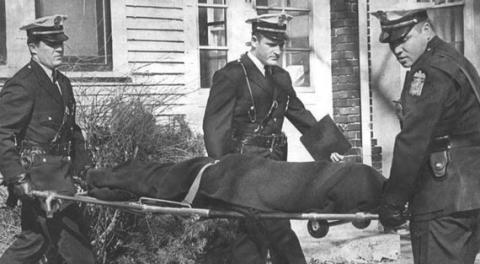 Columbus police carry out the body of Mary Petry. Justin Glanville spent three years researching her death and that of her partner Bill Sproat to make the podcast.