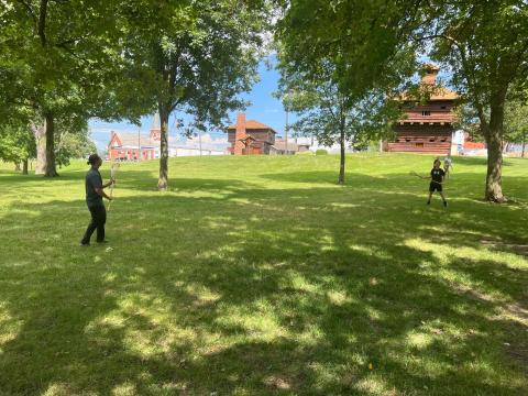  Wyandotte Citizen Caleb Garcia plays lacrosse with a visitor at the Fort Recovery Museum and Monument in Mercer County.