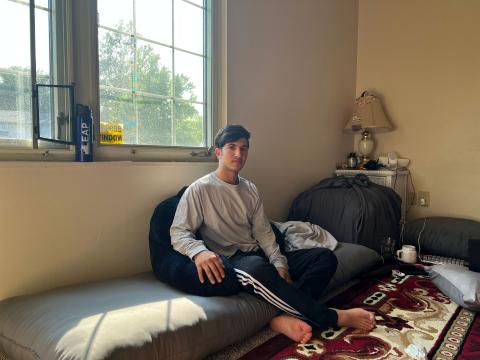  19-year-old Eltaf sitting in his room at his family home before moving out to college.<br/>