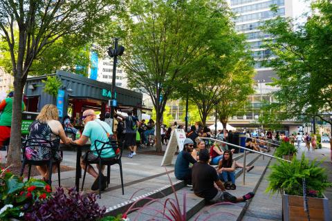  A crowd of people sits in downtown Cincinnati.