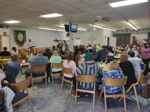 Pastor Chris Avell speaks to congregants inside Dad's Place, a church in Bryan, Ohio. Last year, when the church decided to keep its doors open 24/7, it became a refuge for people experiencing homelessness. In doing so, the city of Bryan claims the church violated zoning rules.