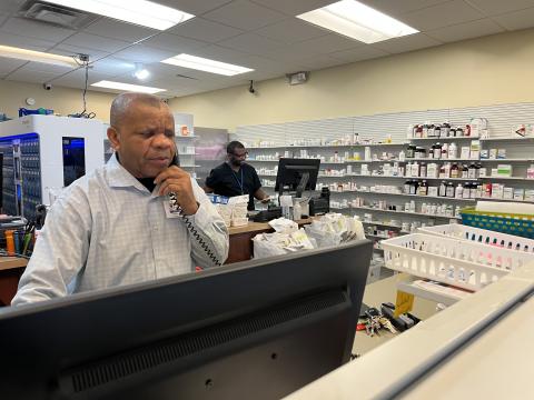 Nnodum Iheme (L), owner of Ziks Family Pharmacy says big chains and small drug stores like his are facing reimbursement issues and feelign the pinch.