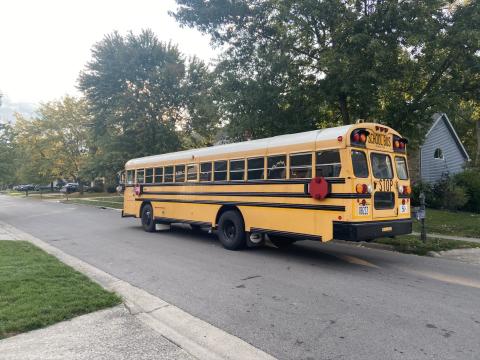  A school bus moves through in a northeast Columbus neighborhood