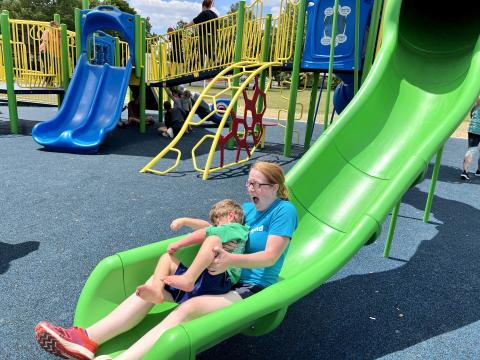 Emily Nagy and her son Josiah try out the slide at Bryan's new inclusive playground.
