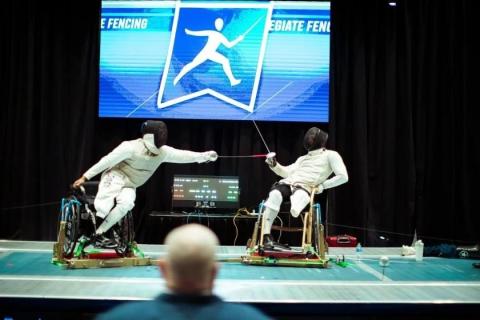Dayton Police Officer Byron Branch lunges at Garrett Schoonover during a parafencing demonstration at Ohio State University.