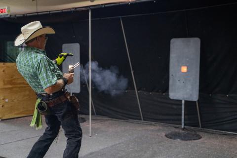 Brian "Doc" Hric, of the Buckeye Rangers, fires in competition at an Ohio Fast Draw Association event in Bellefontaine, Ohio.