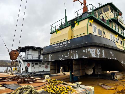 Tugboats like these transport tens of thousands of tons of cargo up and down the Ohio River each day.