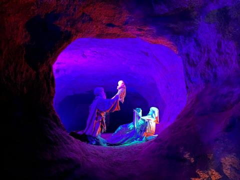 The climax of the Christmas Cave depicts the scene of Jesus's birth, illuminated with colorful lights.