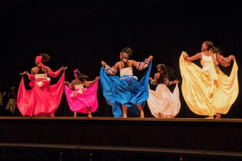 Harambee performers dance at a school assembly during Black History month at Alliance High School. The youth organization ushers in Kwanzaa each year in Youngstown.