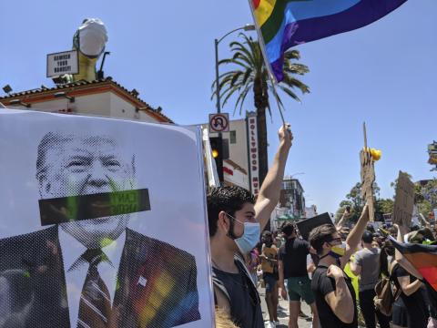 FILE - In this June 14, 2020 file photo, protesters gather on Hollywood Boulevard for a march organized by black members of the LGBTQ community, in the Hollywood section of Los Angeles. Under Trump there have been some rollbacks in civil rights protections for LGBTQ people that Biden is vowing to restore and expand. (AP Photo/Damian Dovarganes, File)