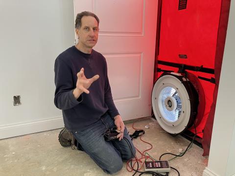 Dwayne Petko conducts a blower door test and explains how it works at a house in Sunbury, Ohio.