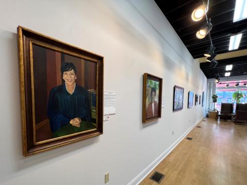 A series of portraits hang on the walls of Bing Davis's art studio in Dayton. They showcase the city's skyscrapers — not its towering buildings, but high-achieving Black community members.