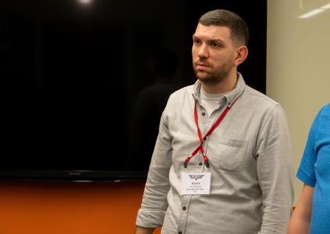 Kevin McClelland, baritone in the Burning River Boys, listens intently to coaching at the Top Gun weekend.