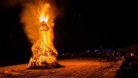 A giant snowman burns on the beaches Port Clinton in February of 2023. The winter festival has been an annual tradition for a decade.