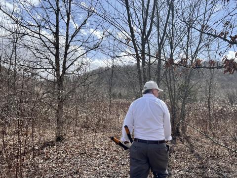 David Funk walks through one of his wooded properties in Athens County. He's actively managing his forest to capture more carbon.