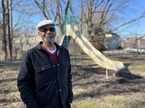 Kalen Howell stands in Barbara Howell Park on Market Street in Urbana. He's working to restore the park to honor his grandmother's legacy.