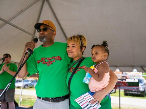 Kalen Howell speaks into a microphone at the first annual Black Heritage Festival in 2022.