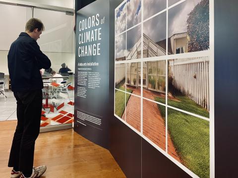 Visitors engage with the Colors of Climate Change data art exhibit, hosted at the Toledo Lucas County Public Library last year.