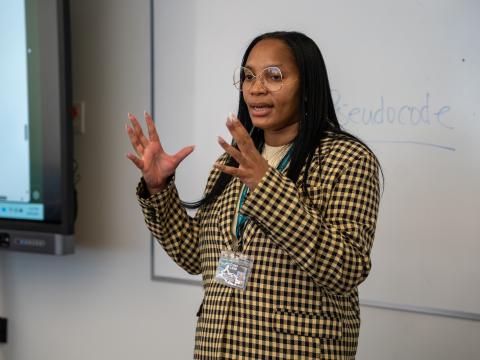Professor Carelicha Duckworth speaks to her intro-level computer science class at Tri-C, where the curriculum revolves around teaching students to use AI tools responsibly.