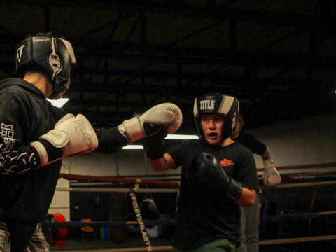 Lynix Lemtz, 13, left, spars with Chris Dennis, 11, during an evening practice at the Zanesville PAL boxing gym.