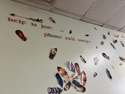 The feathers on the wall at the Talbert House, a crisis call center in Cincinnati, are reminders of the lives they've saved. Across the state in Carroll County, community health workers are raising awareness about the suicide and crisis lifeline, 988.