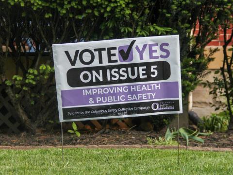 A sign in Columbus' Franklin Park neighborhood shows support for Issue 5, a charter amendment that will create a community crisis response team to answer non-violent 911 calls in place of police.