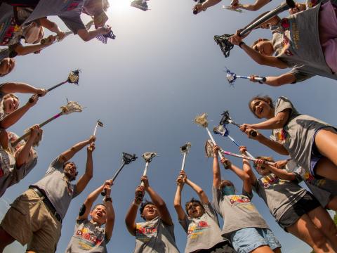 Myaamia youth start a game of peehkitahaminki, or lacrosse. The tribe has revitalized traditional ways of playing the sport over the past couple of decades.