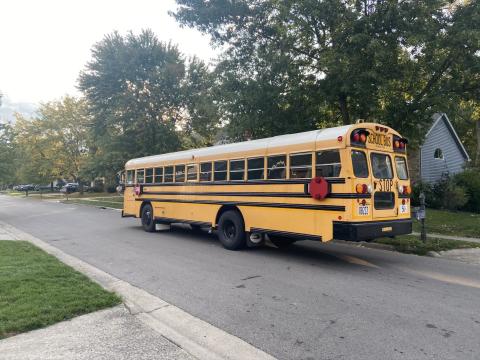 A school bus moves through in a northeast Columbus neighborhood