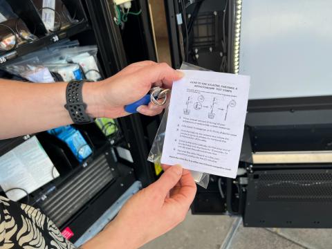 Suzanne Bachmeyer holds up instructions for a fentanyl test strip. The harm reduction tool can no longer be funded through federal Substance Abuse and Mental Health Services grants.