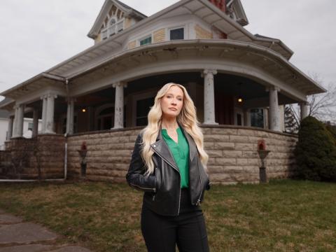 HGTV host Anna Camp stands in front of Bihl Manor in Fremont — the first haunted home to be featured on "A Very Haunted Renovation."